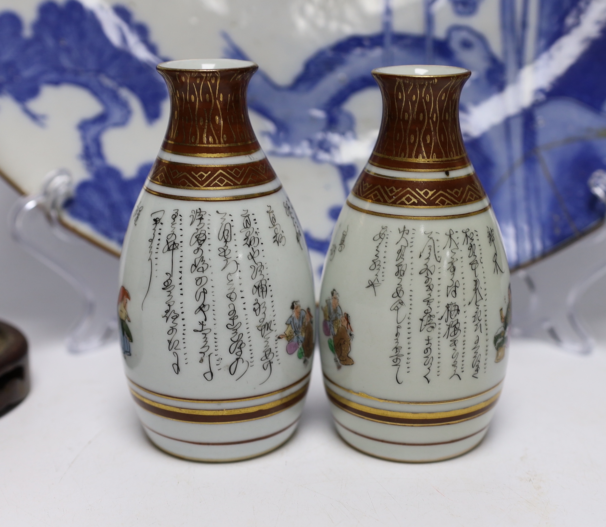 Japanese and Chinese ceramics including blue and white bamboo plate, blanc de chine figures, and Buddha with erotic scene to the base, largest 42cm high